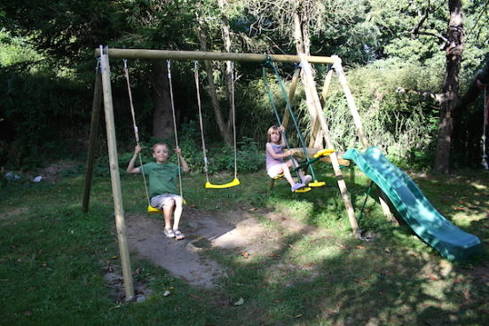 kids on garden swing